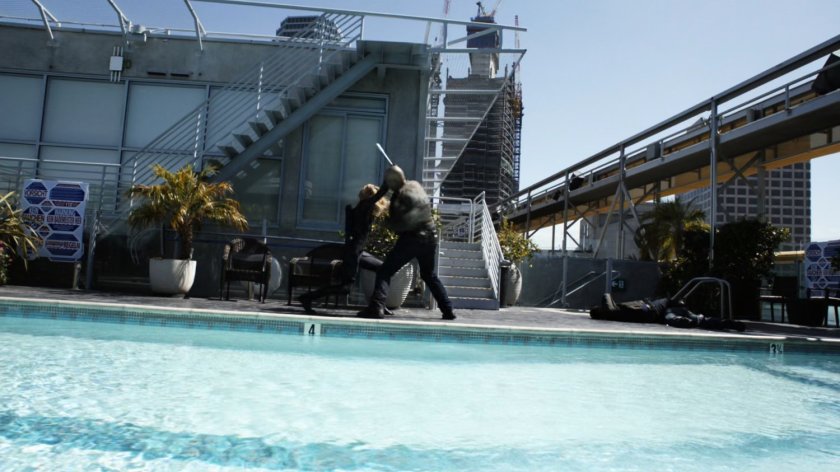 Bobbi fights Kebo on the rooftop of Lisbon penthouse.