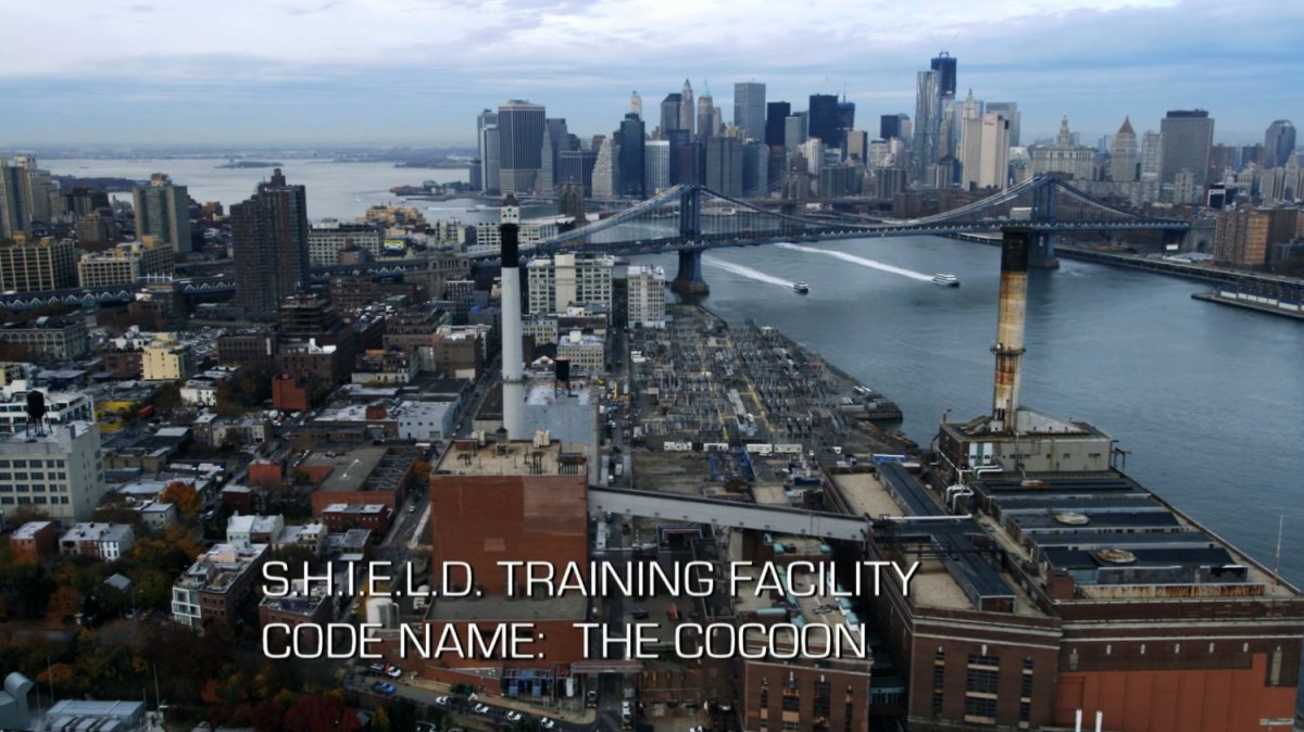 Aerial view of Brooklyn and East River. Text: SHIELD Training Facility, Code Name: The Cocoon.