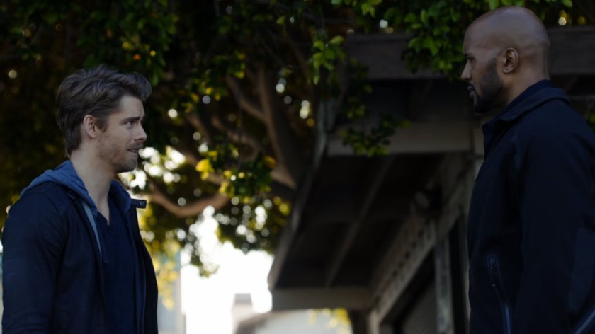 Mack and Lincoln talking at a park.