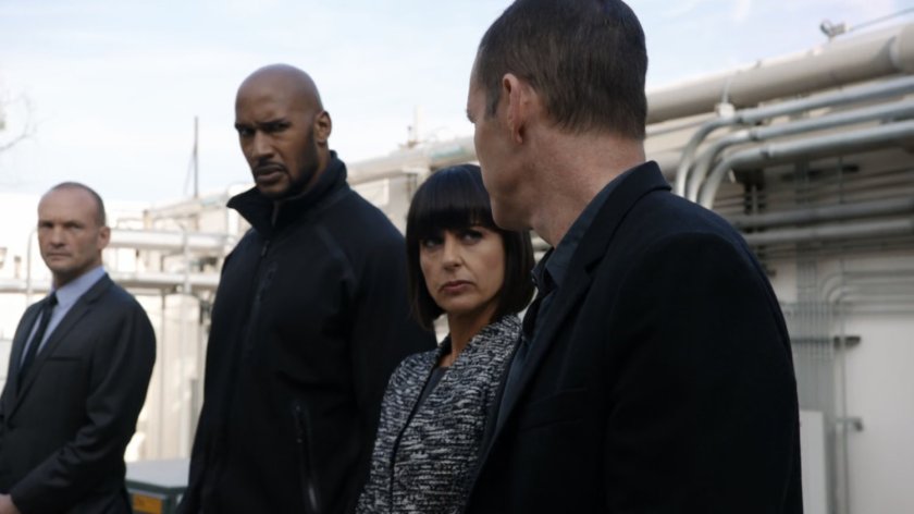 Banks, Mack, Rosalind, and Coulson outside a loading dock in Maryland.
