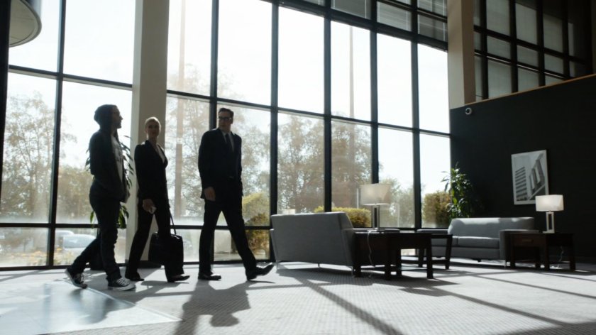 Steve shows Hunter and Bobbi around the ATCU lobby.