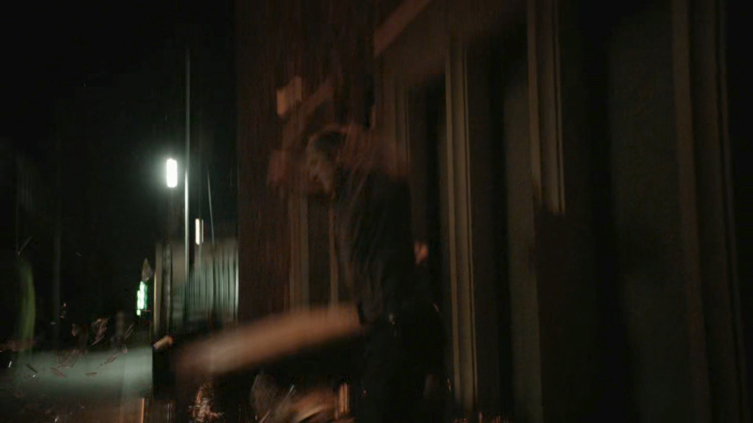 Coulson jumps into alley behind Washington DC apartment.