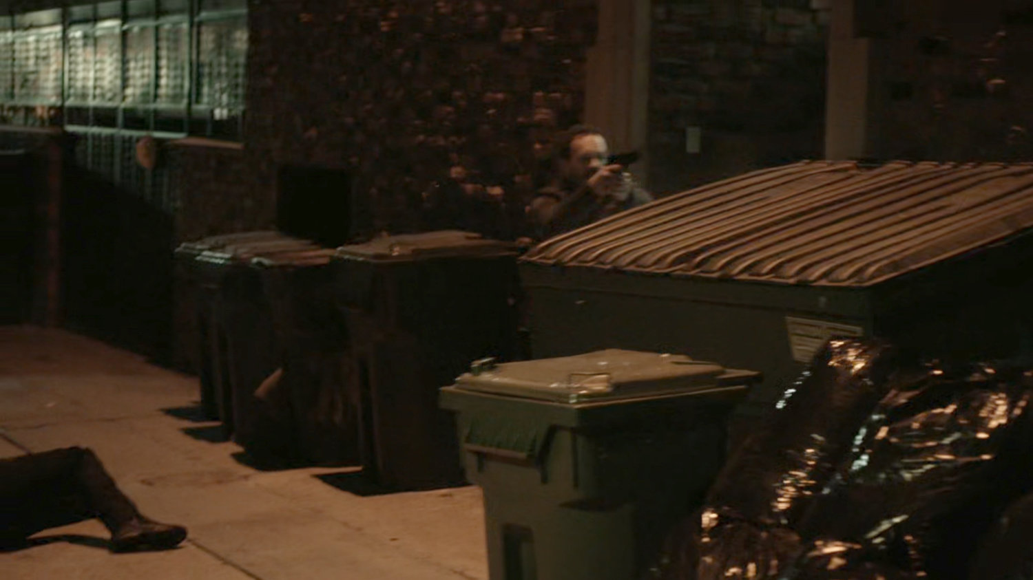 HYDRA agent hiding behind dumpster in alley behind Washington DC apartment.