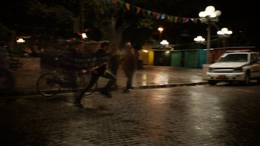 Yo-Yo Rodriguez running across plaza in Bogota.