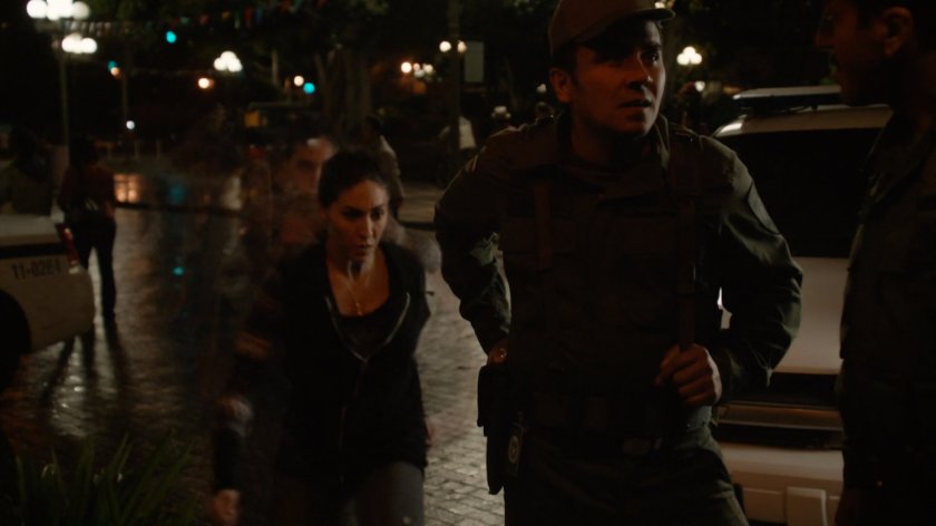Yo-Yo Rodriguez grabbing guards security card in plaza in Bogota.