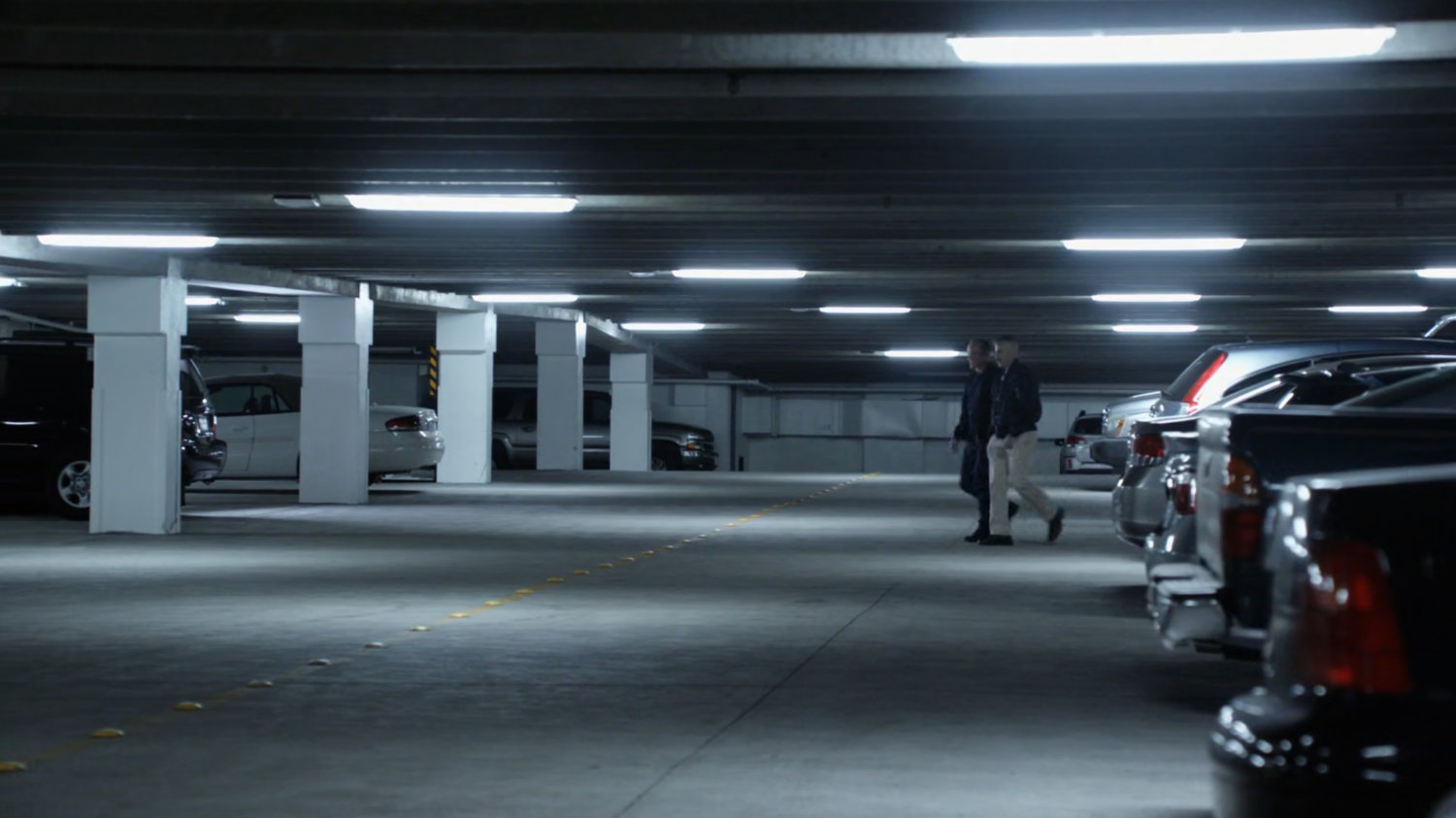 Talbot and Coulson in parking garage.