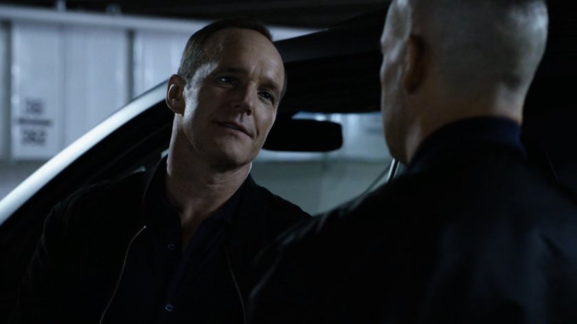 Talbot and Coulson in parking garage.