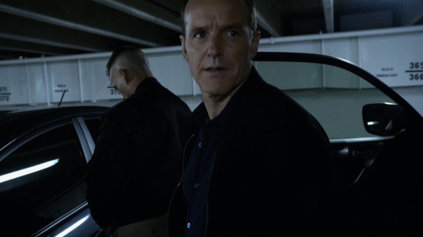 Talbot and Coulson in parking garage.
