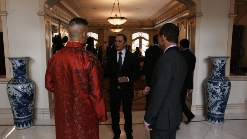 Coulson and Talbot talk with Anton Petrov in front hallway of Taiwanese mansion.