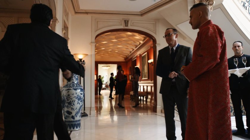 Coulson and Talbot talk with Anton Petrov in front hallway of Taiwanese mansion.
