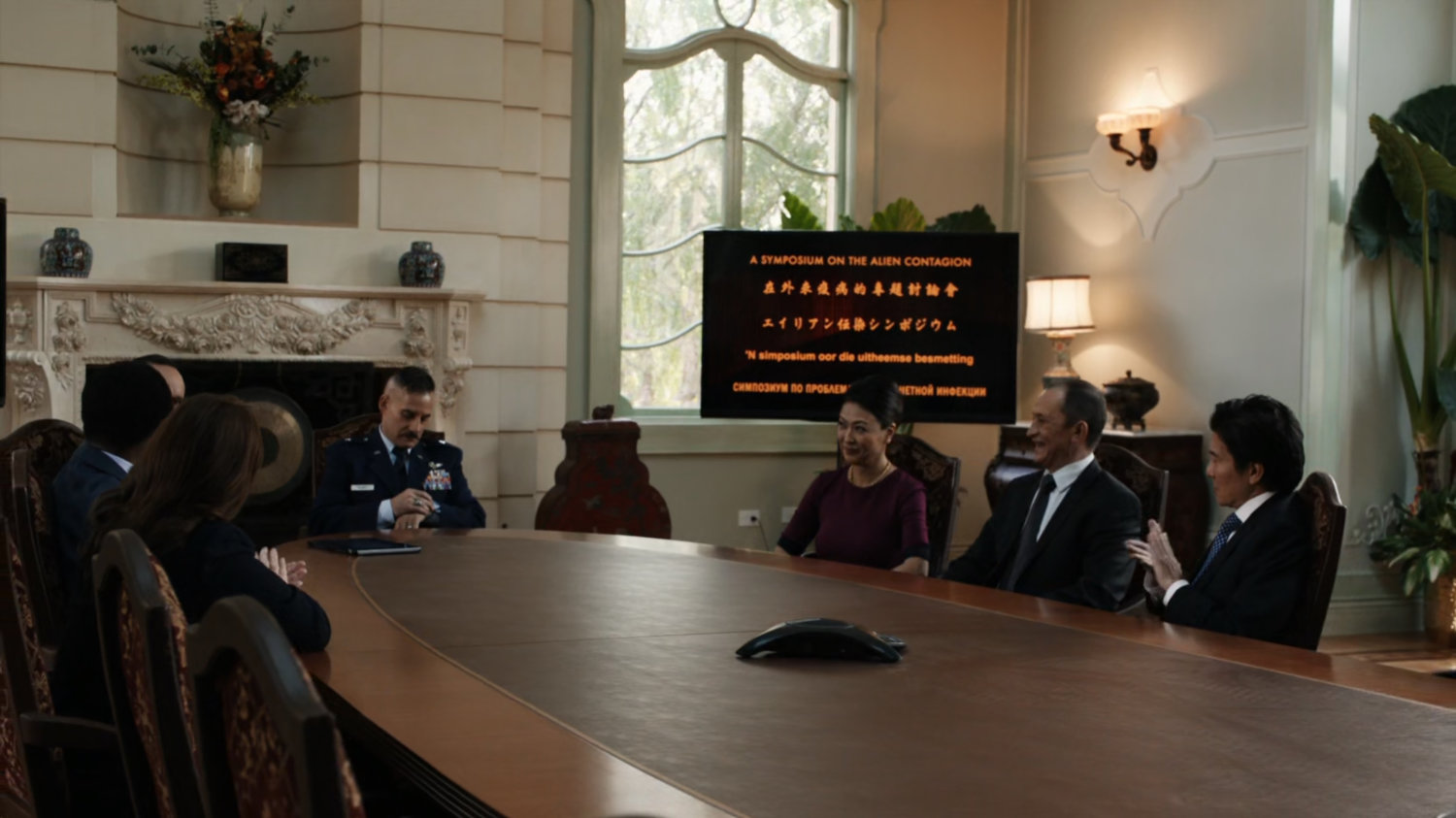 Talbot and other delegates in meeting room of Taiwanese mansion.