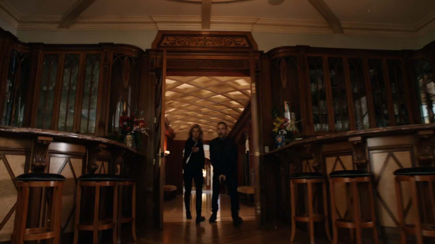Bobbi and Hunter entering meeting room of Taiwanese mansion.