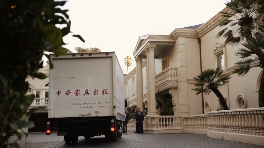 Van in front drive of Taiwanese mansion.