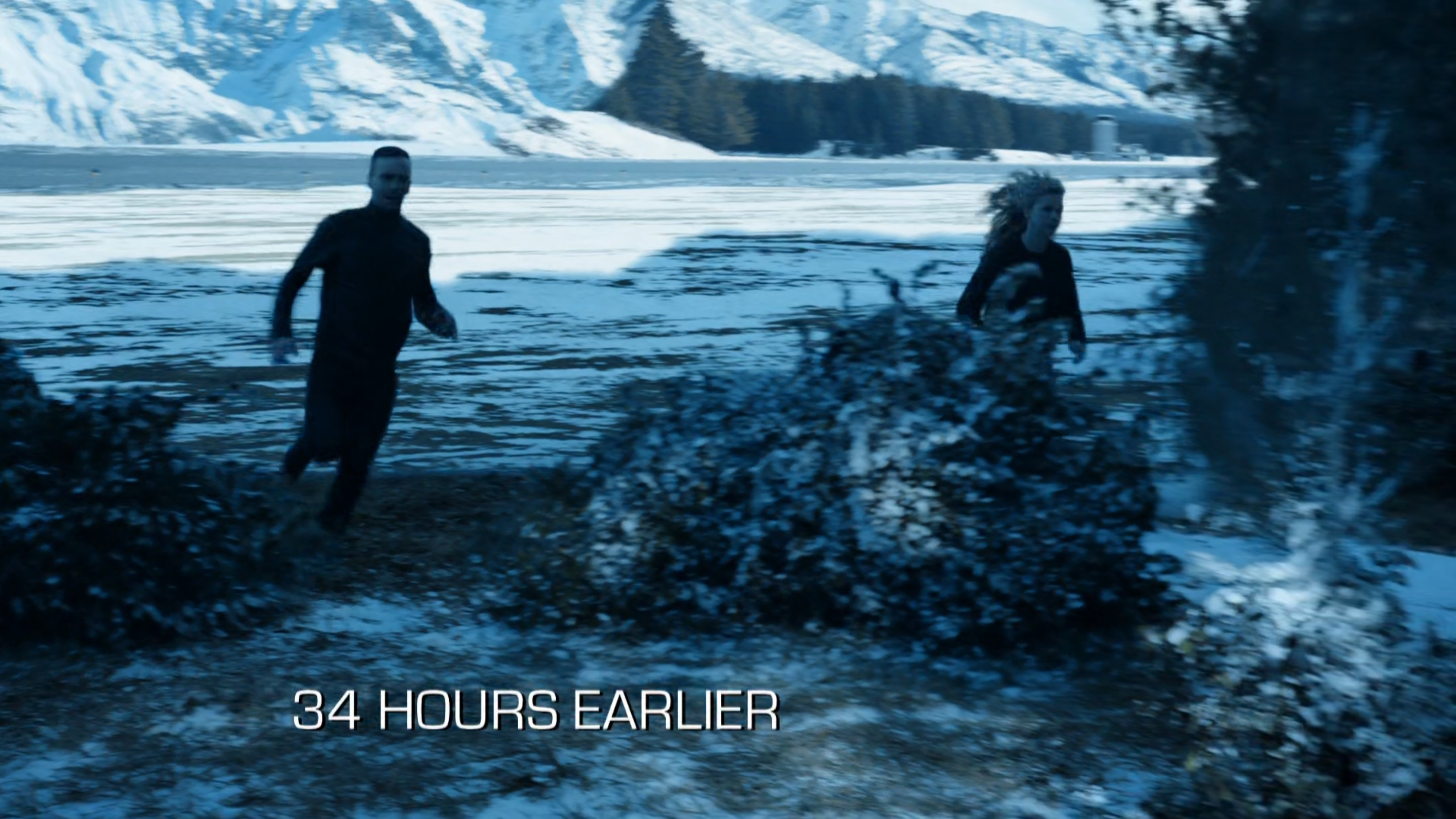 Hunter and Bobbi running into the snowy woods. Text: 34 hours earlier.
