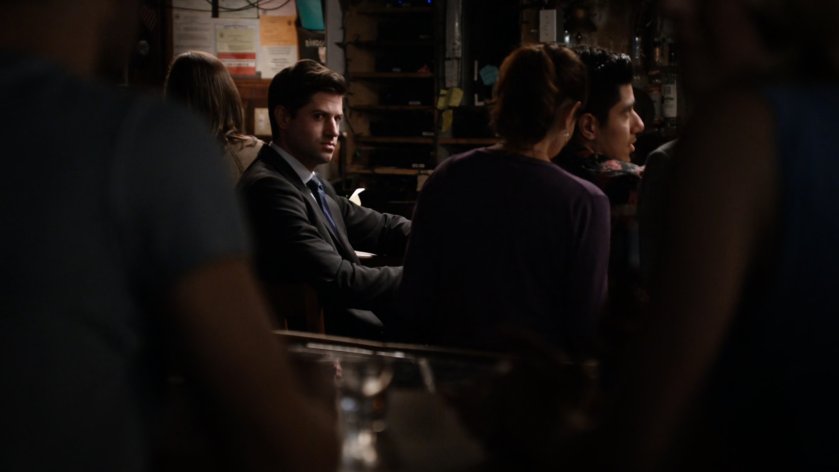 Man watching Hunter and Bobbi inside Teddy's Bar.