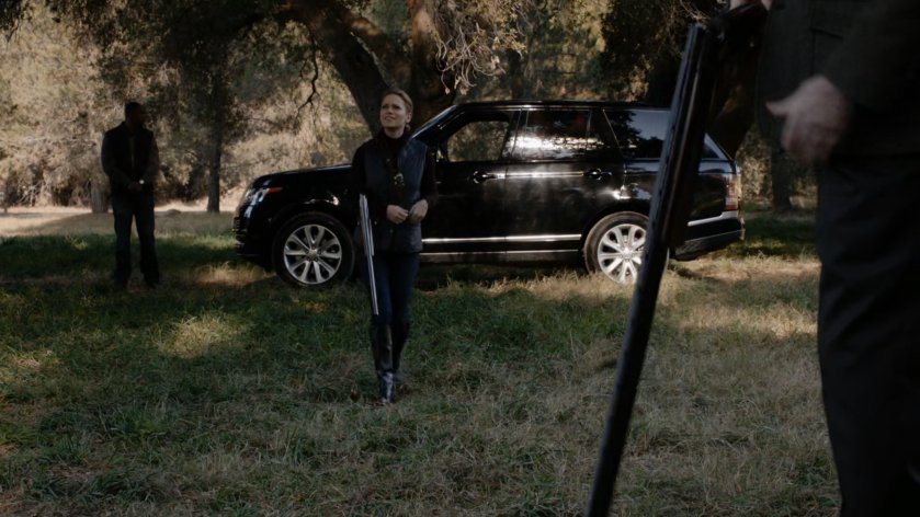Malick's daughter by a lake.