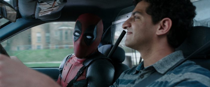 Deadpool and Dopinder in a taxi cab.