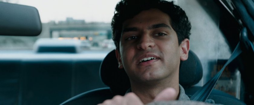 Dopinder driving a taxi cab.