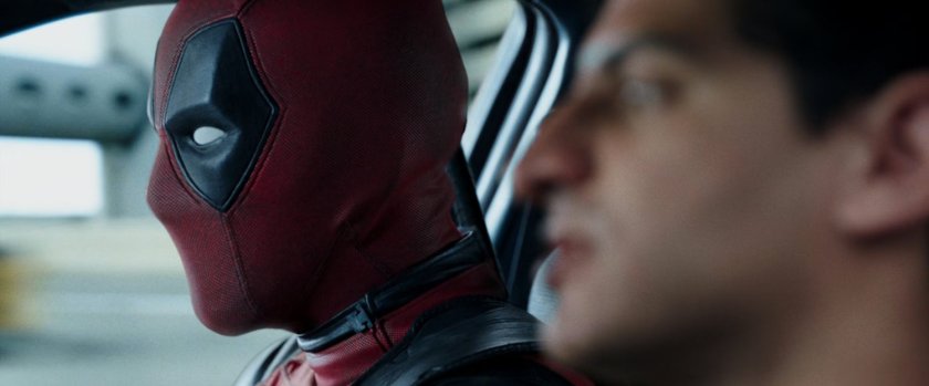 Deadpool and Dopinder in a taxi cab.