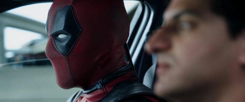 Deadpool and Dopinder in a taxi cab.