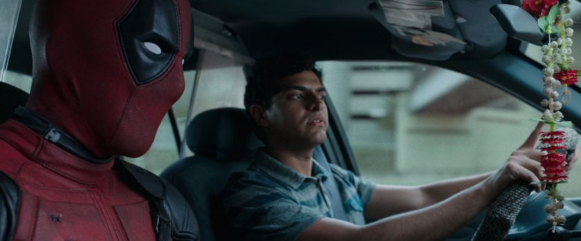 Deadpool and Dopinder in a taxi cab.