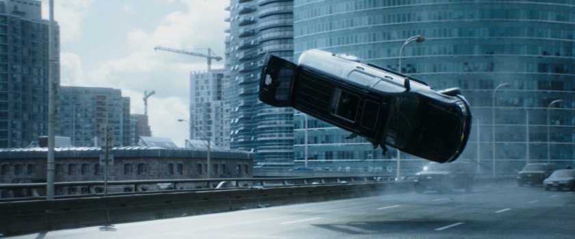 SUV flipping over freeway road.