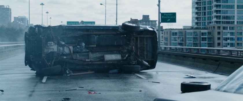 SUV rolled on its side on a freeway overpass.