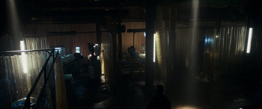 Makeshift hospital rooms in a converted warehouse.