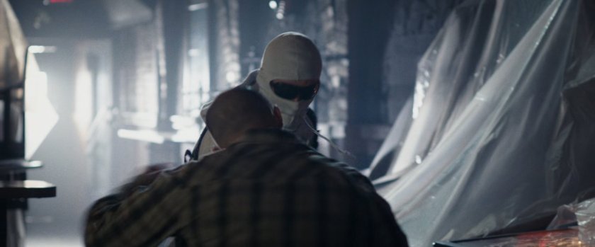 Wade beating someone up inside a bar.