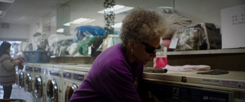 Blind Al in a laundromat.