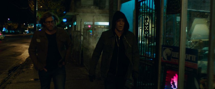 Wade and Weasel on sidewalk outside strip club.