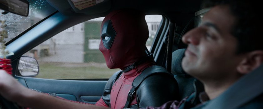 Deadpool and Dopinder in a taxi cab.