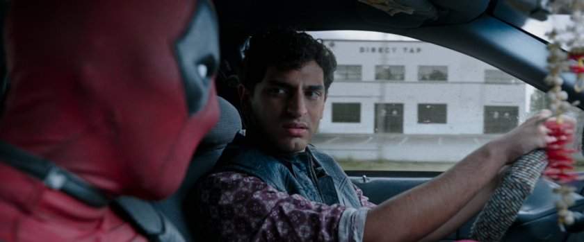 Deadpool and Dopinder in a taxi cab.