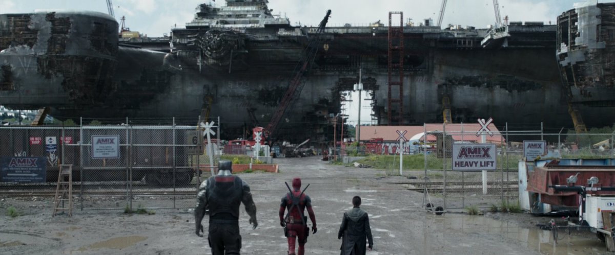 Colossus, Deadpool, and Negasonic Teenage Warhead entering scrap yard.