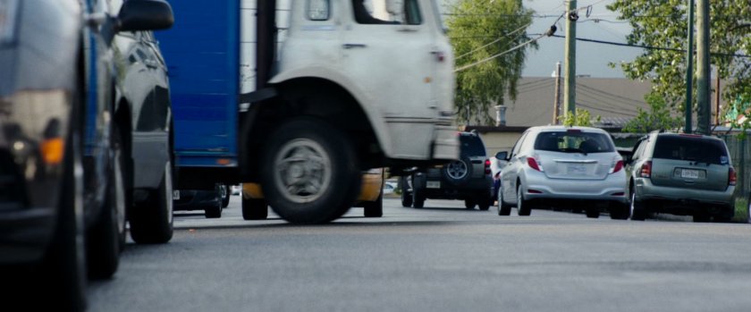 Truck pulling out in front of taxi cab.