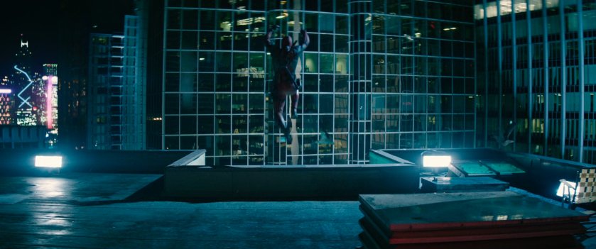 Deadpool leaping off roof in Hong Kong.