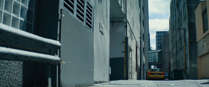 Cab parked in alley outside drug warehouse.