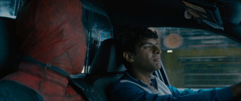 Deadpool and Dopinder in a taxi cab.
