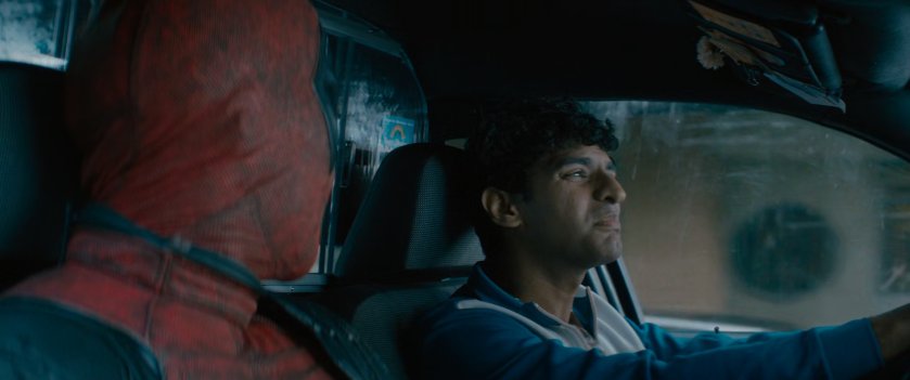 Deadpool and Dopinder in a taxi cab.