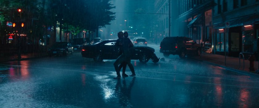 Wade fighting man in intersection.