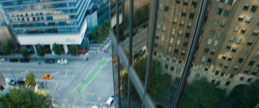 View of street and buildings during fall from high rise.