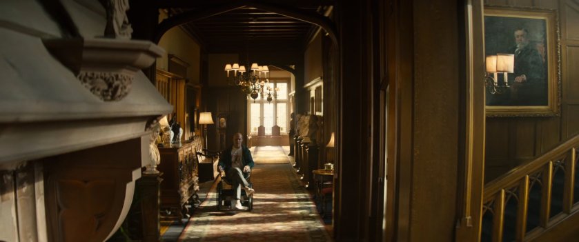 Wade riding through the X-Mansion on a motorized wheelchair.