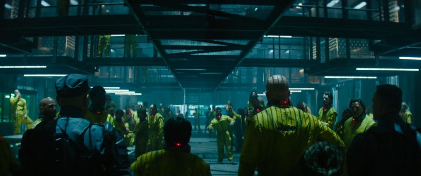 Prisoners inside the Ice Box prison taunt new arrivals Russell and Deadpool.