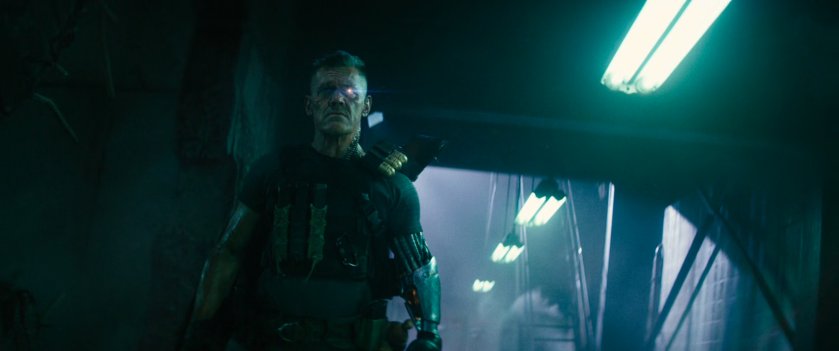 Cable walking through an interior hallway of the Ice Box prison.