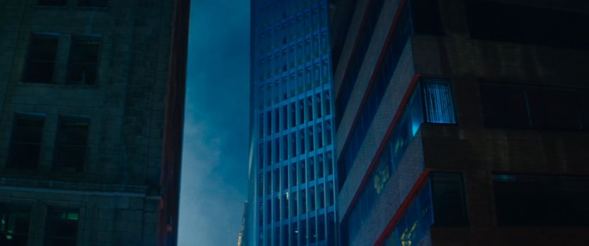 Looking up at hotel high rise from alley.