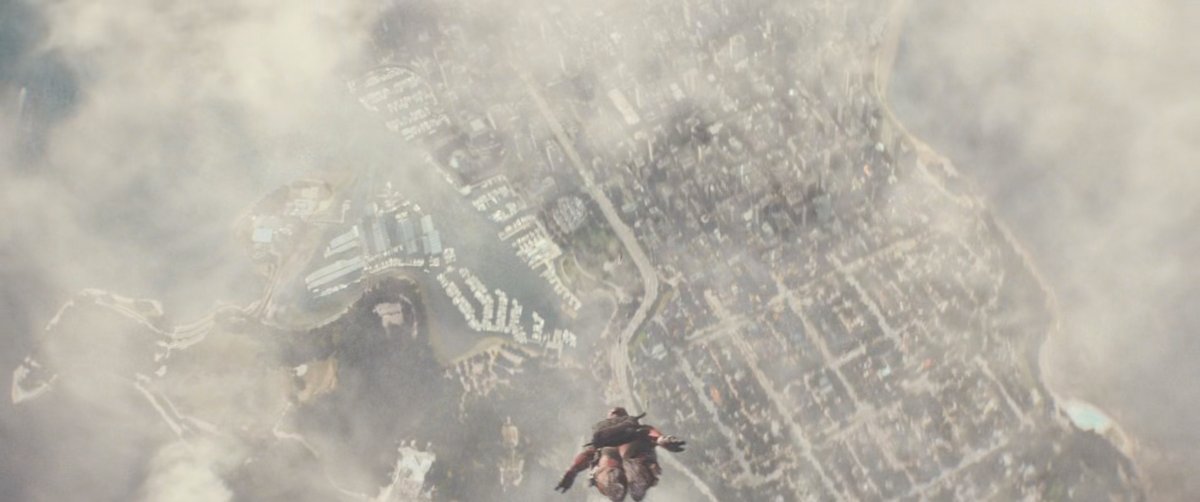 Deadpool skydiving with city below him.