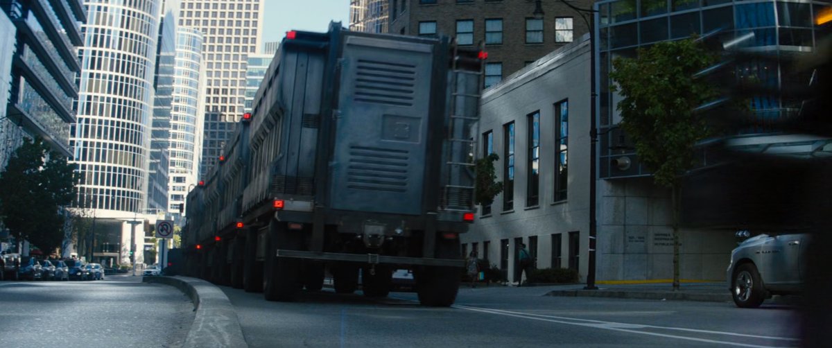 Prison convoy drives into city.