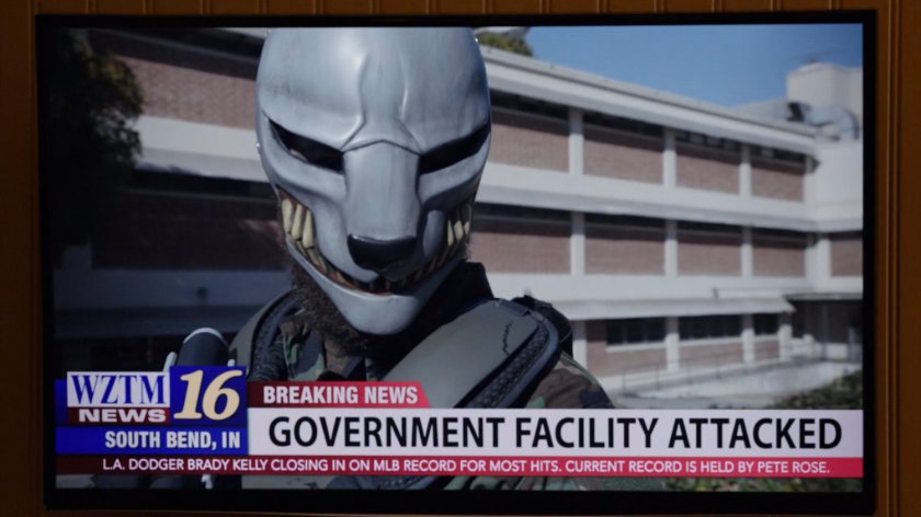 Television showing news broadcast of Watchdog group issuing warning.