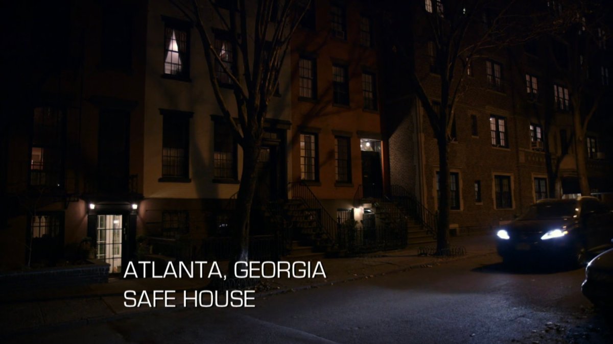 Exterior of brownstone at night. Text: Atlanta, Georgia. Safe House.