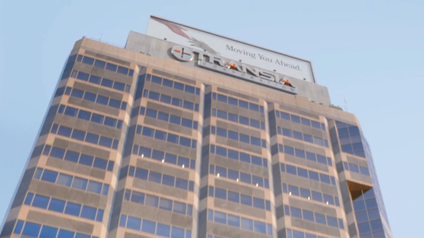 View of top floors of Transia Corporation from plaza.